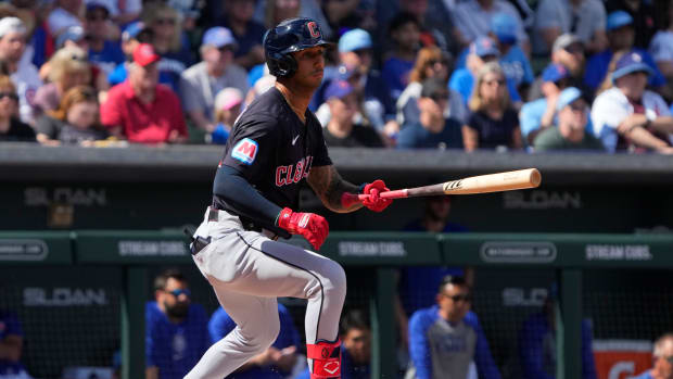 Mar 3, 2024; Mesa, Arizona, USA; Cleveland Guardians shortstop Brayan Rocchio (4) hits against the Chicago Cubs in the first inning at Sloan Park.